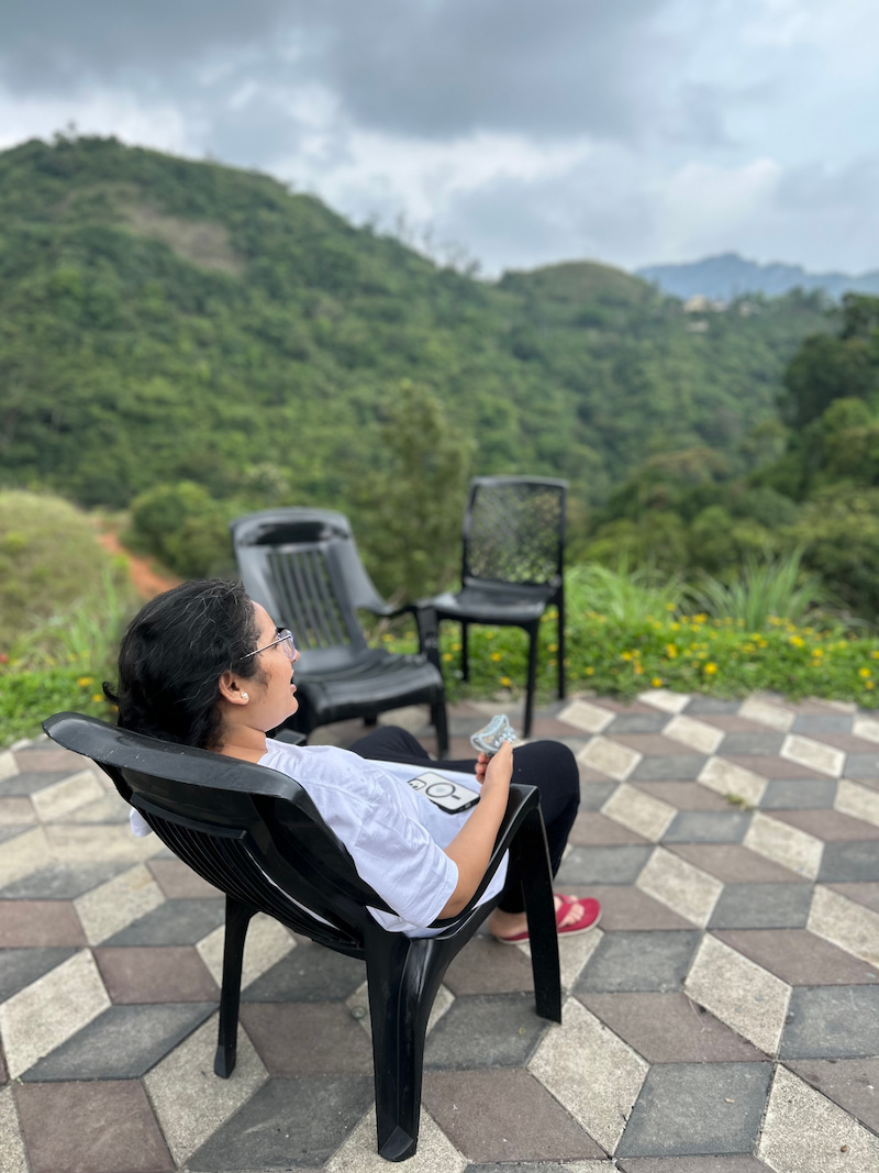 tripti-sitting-on-chair.jpg